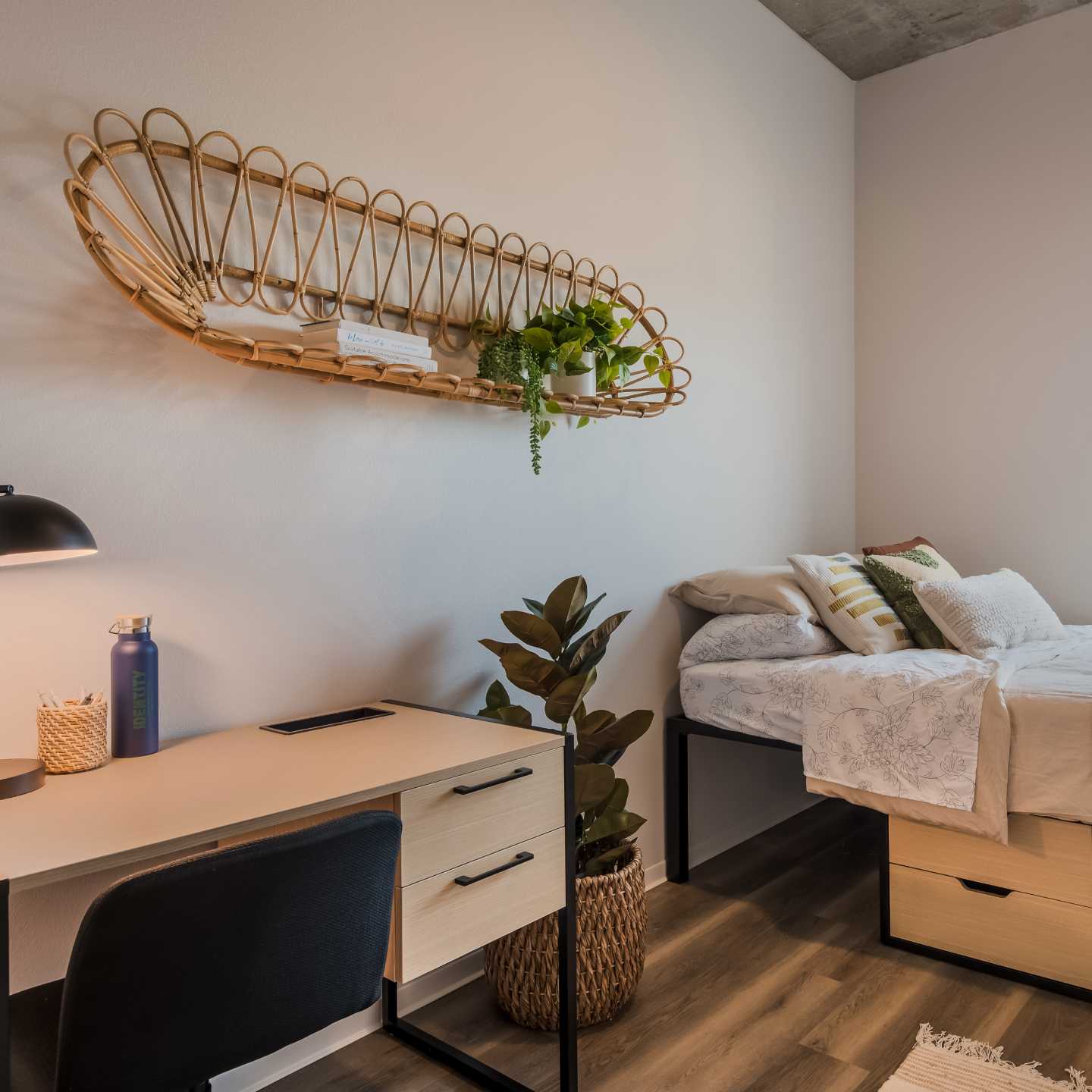 A bedroom with a study desk