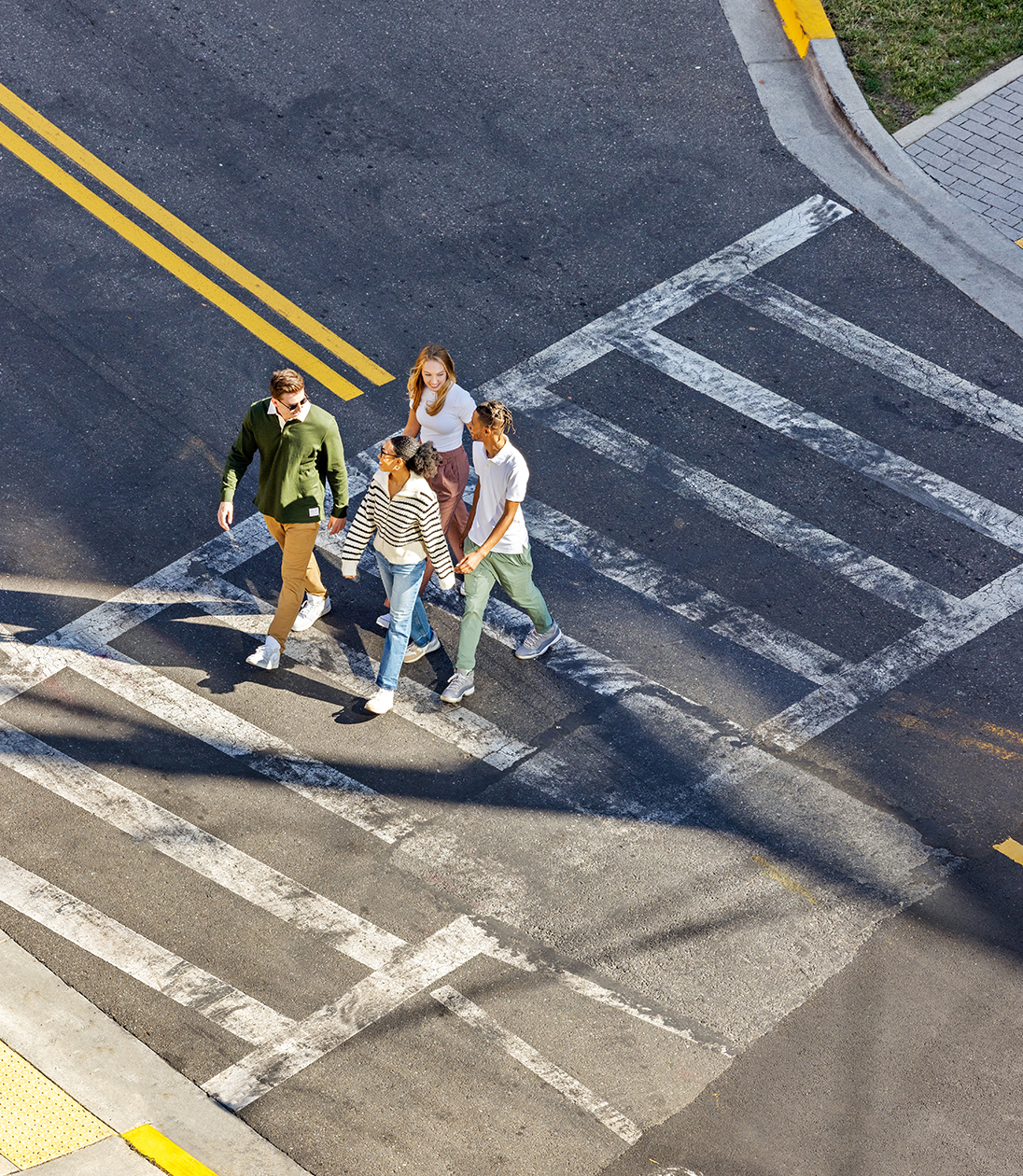 Friends using a crosswalk